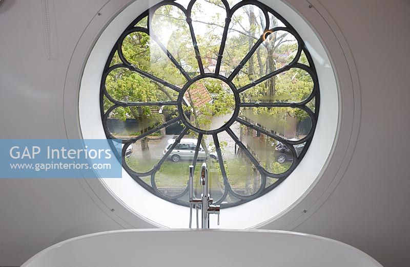 Old round church window in the bathroom 