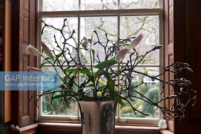 Vase of flowers in window 