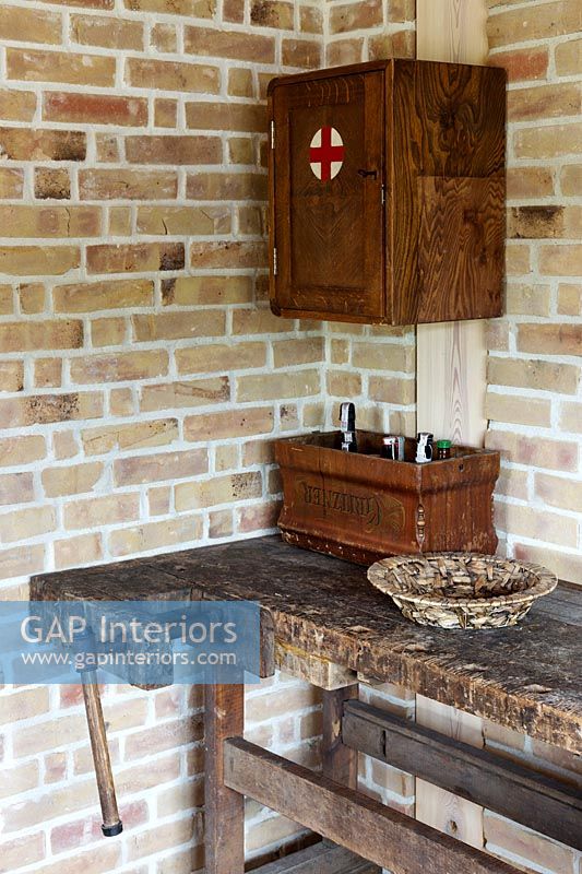 Old carpentry table and wooden cupboard