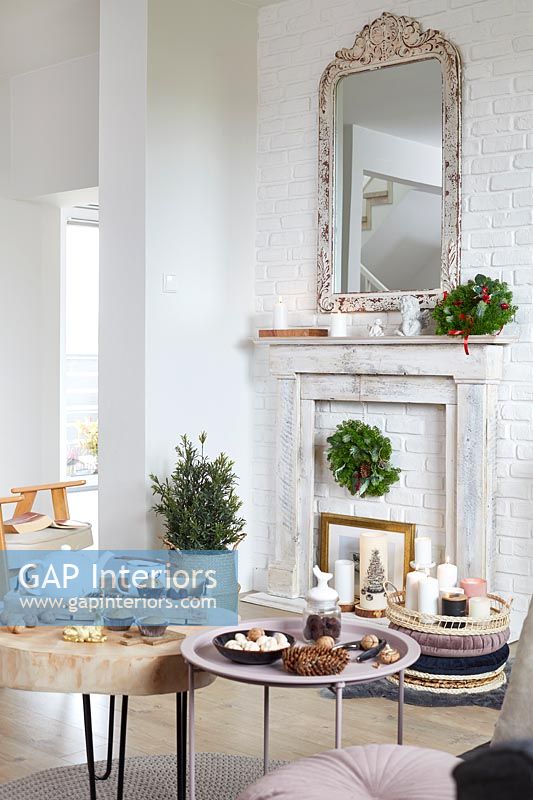 Modern country living room decorated for Christmas - afternoon tea and cakes on table 