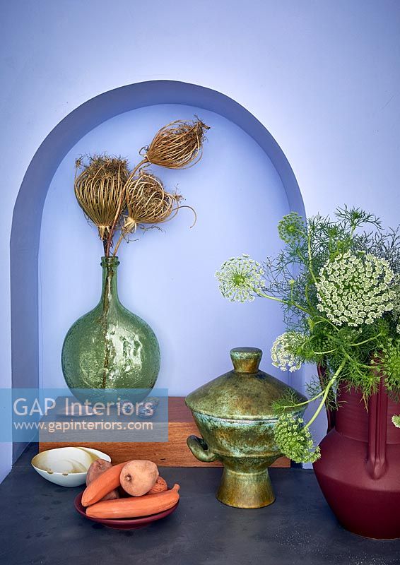 Vase and collectibles in alcove 
