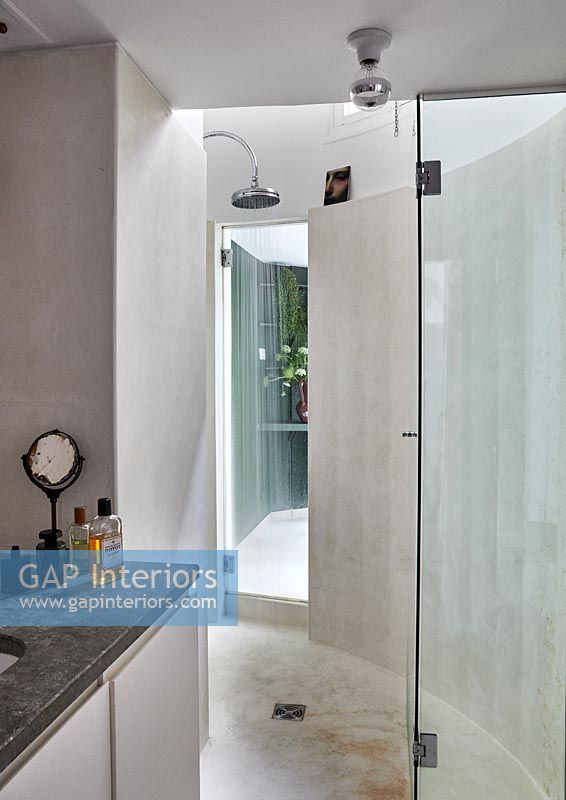 Shower in modern bathroom with curved walls 