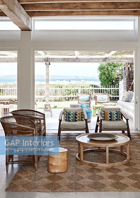 Living room with view to balcony and sea view beyond 
