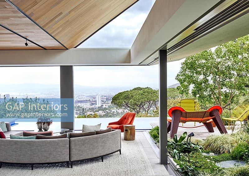 Contemporary living room with a retractable roof 
