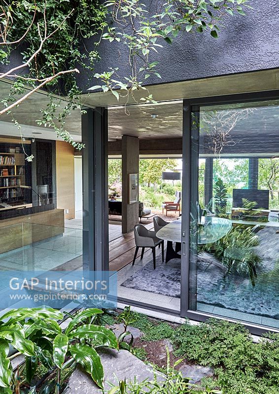 View into contemporary home through sliding patio doors 