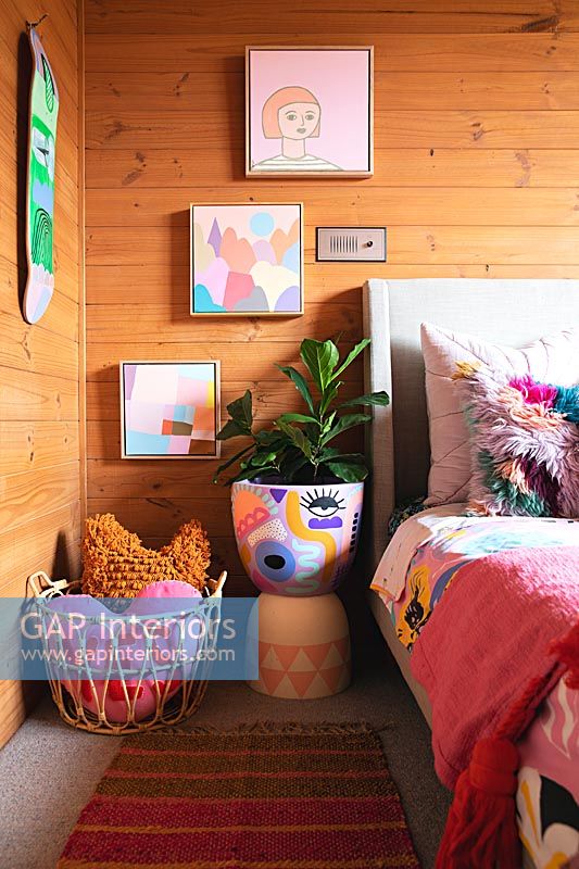 Colourful childrens room with decorative pot for houseplant 