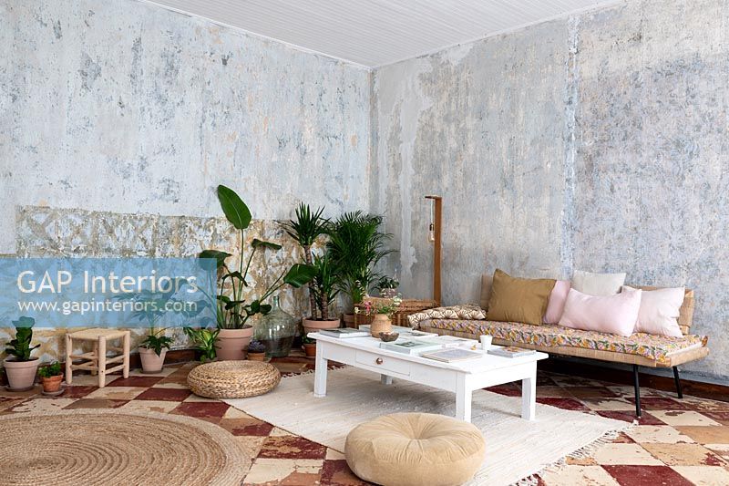Country living room with bare plaster walls 