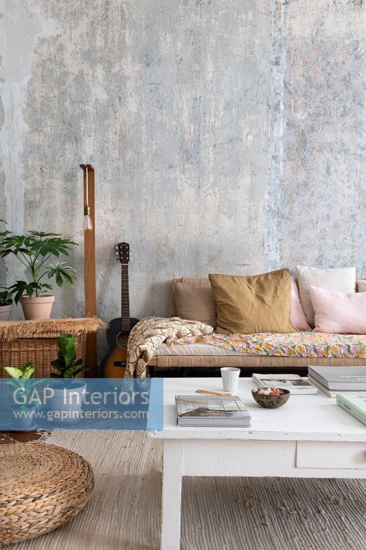 Country living room with bare plaster walls