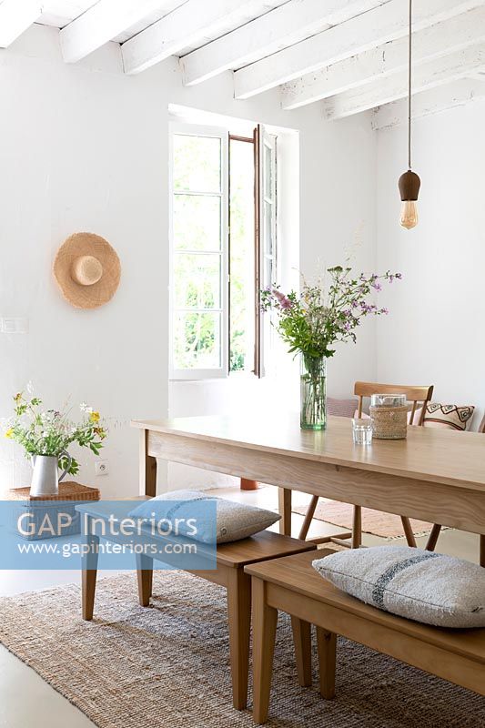 White country dining room with wooden furniture 
