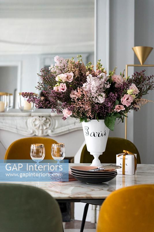 Vase of flowers on vintage dining table 