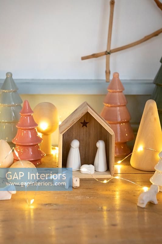 Modern nativity set with fairy lights 