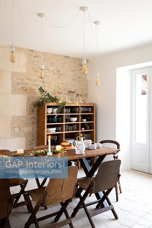 Country dining room with exposed stone wall - decorated for Christmas 