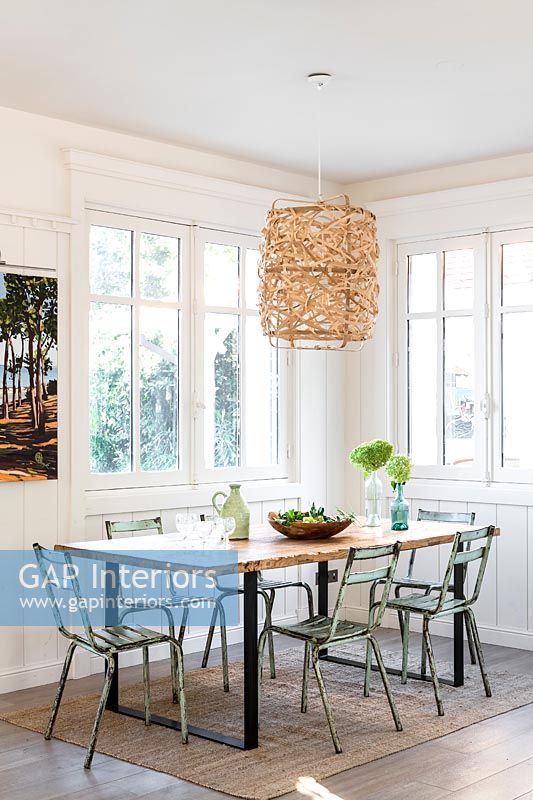 Large seagrass pendant light over dining table 