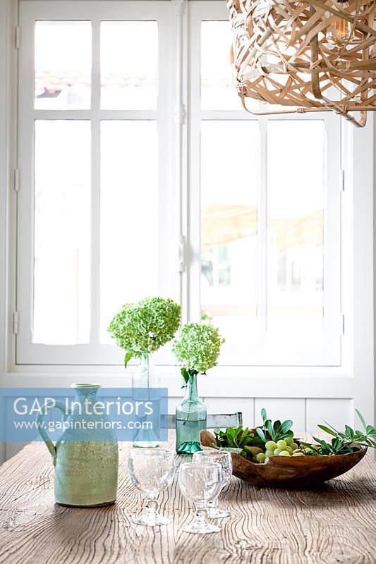 Green accessories on country dining table 