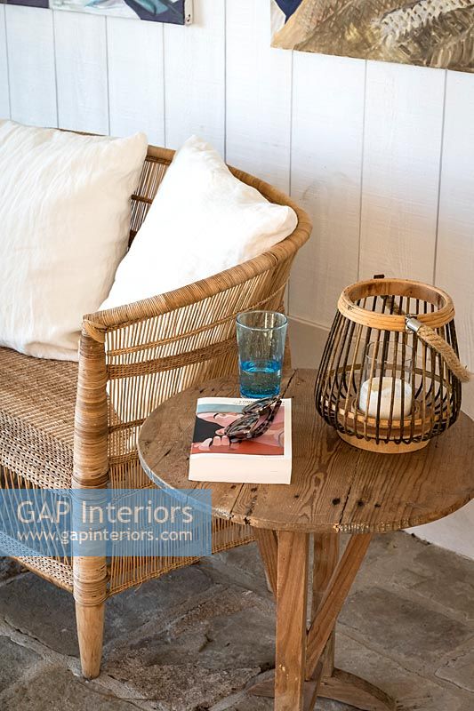 Book and sunglasses on wooden side table 