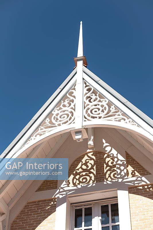 Architectural detail of decorative pitched roof - classic villa exterior 