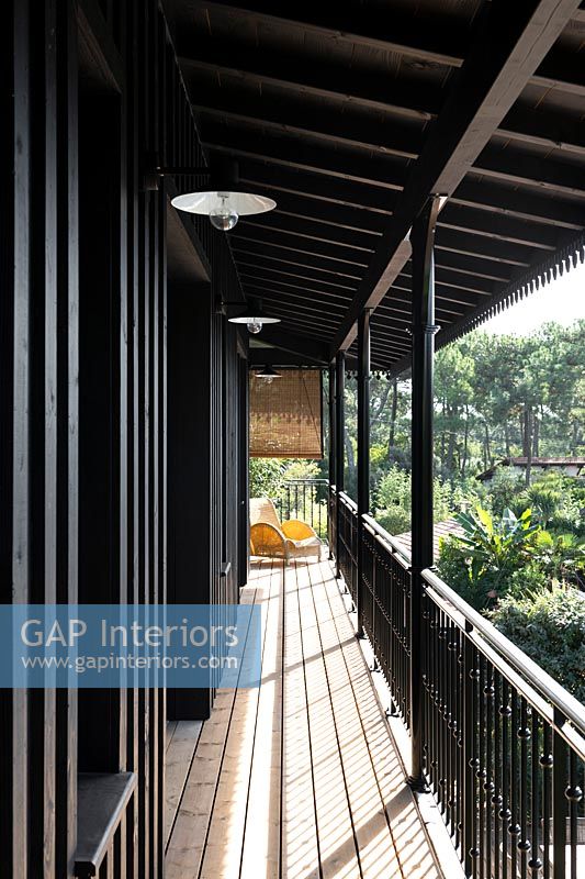 Wooden veranda with railings 