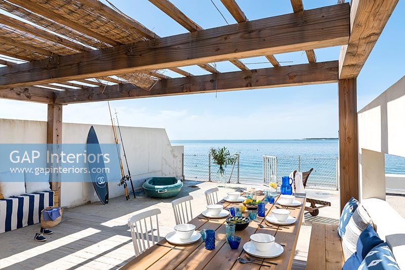 Outdoor dining area overlooking the sea 