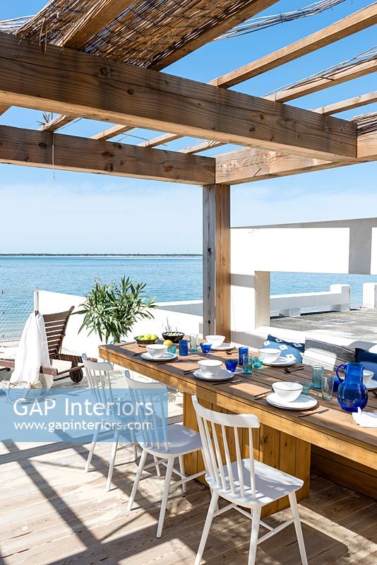 Dining area on decking with sea views 