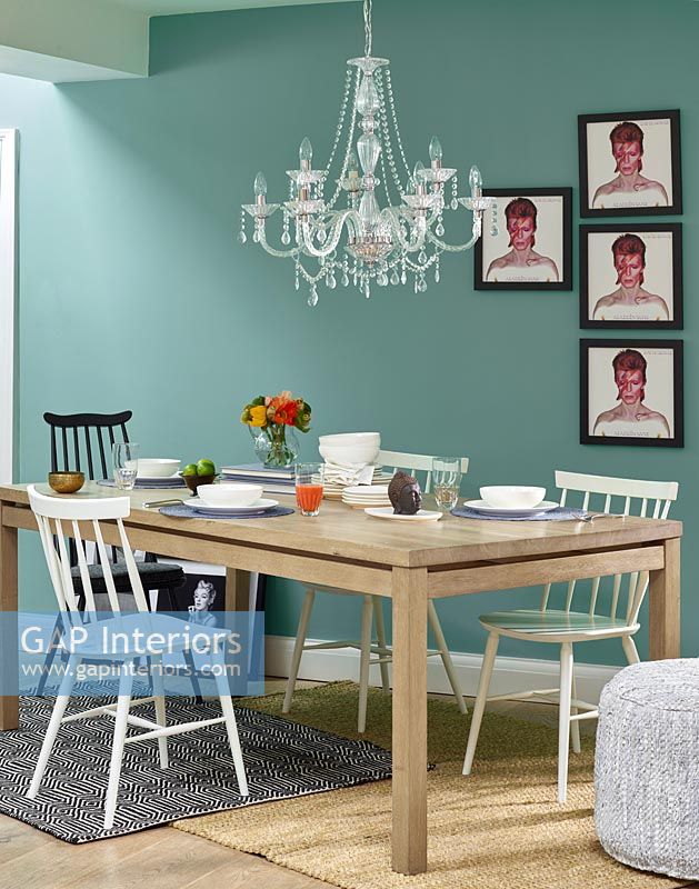 Modern dining room with display of David Bowie pictures 