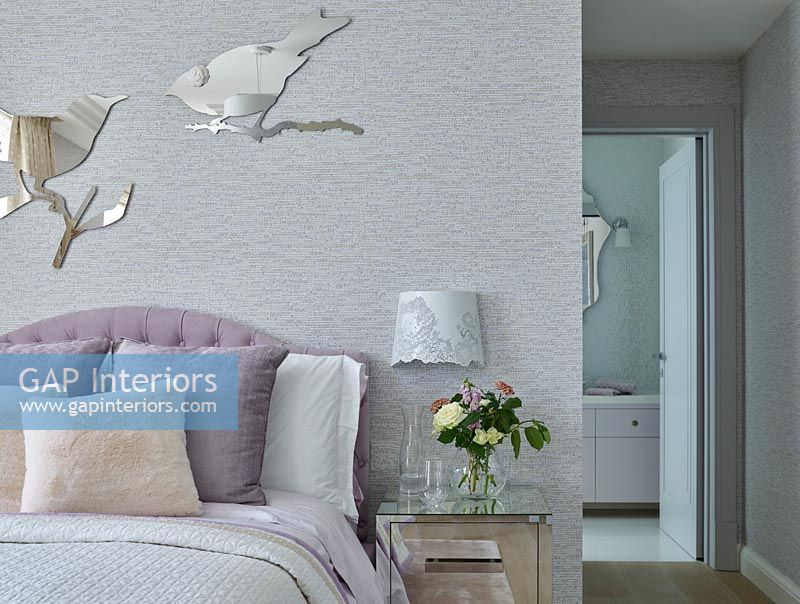 Modern bedroom with bird shaped mirrors 