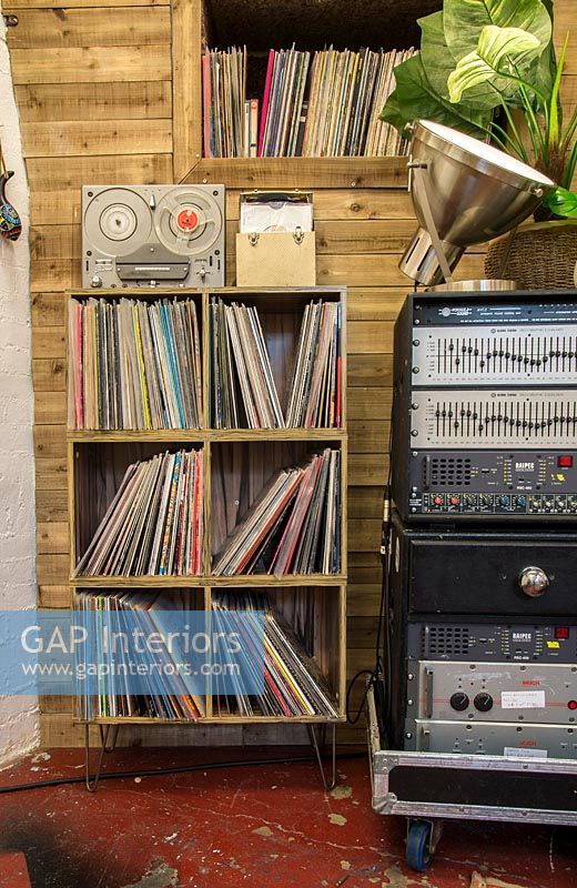 Shelves of vinyle records in music room - recording studio 