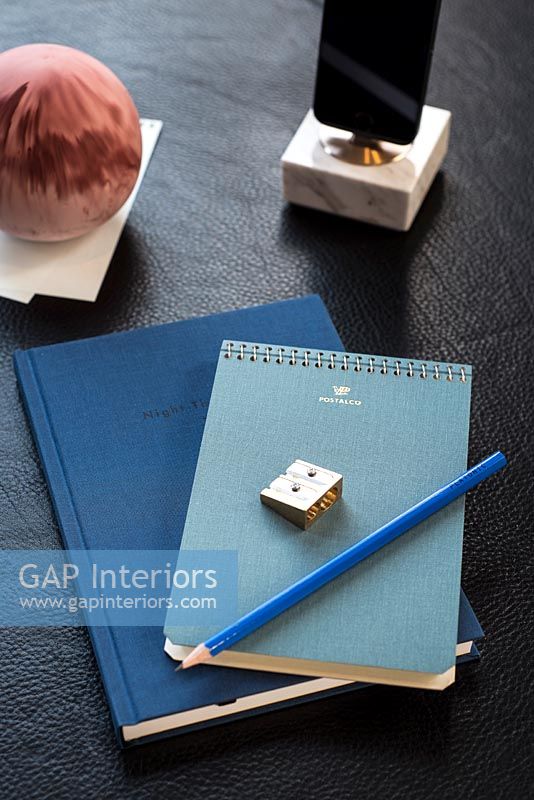 Blue notebooks and accessories on desk 