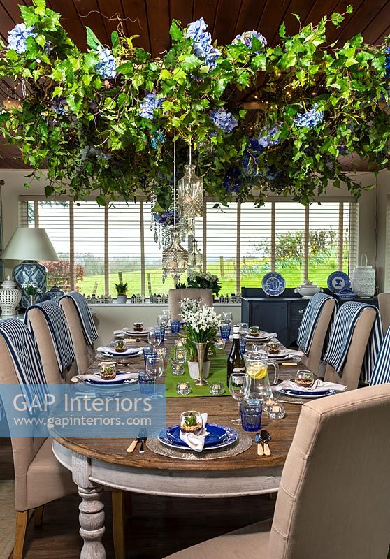 Modern dining room with large floral decoration 