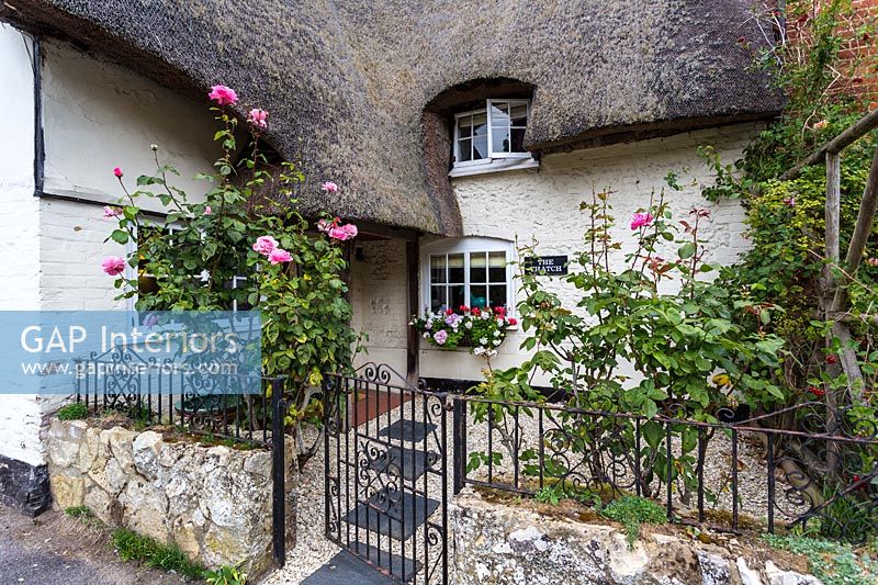 Thatched country cottage exterior 