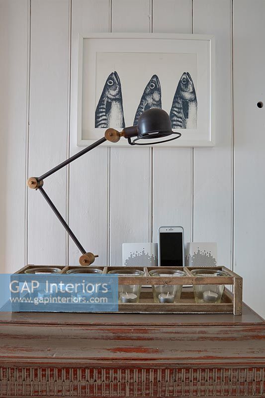 Vintage desk lamp and painting of mackerel fish