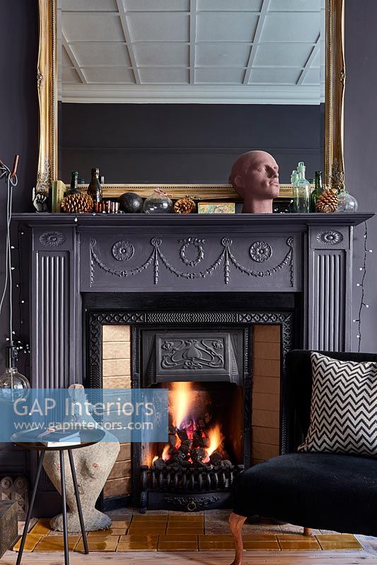 Classic fireplace with large mirror 