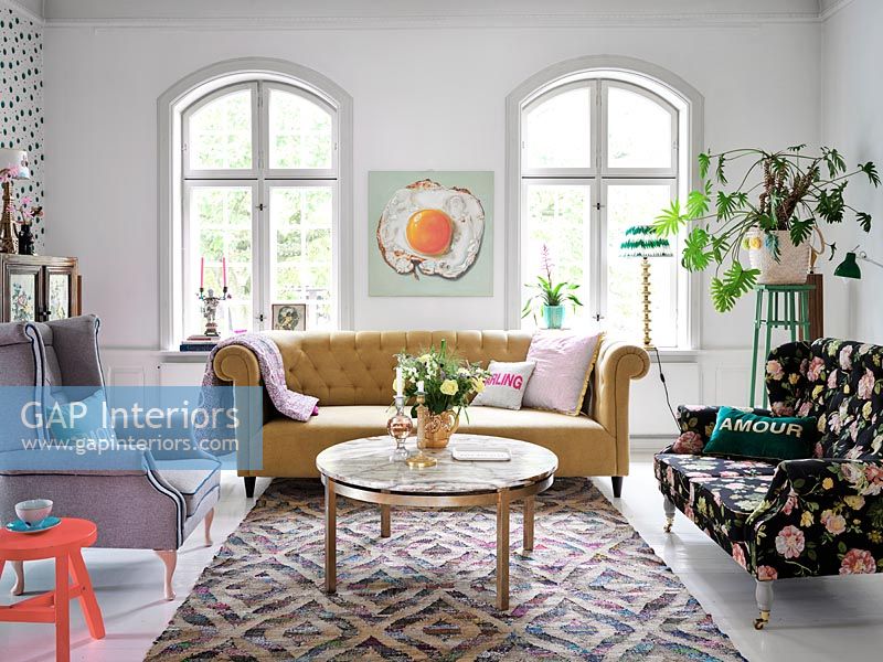 Patterned rug in white painted modern living room 
