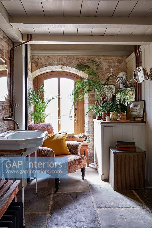 Armchair in country bathroom 