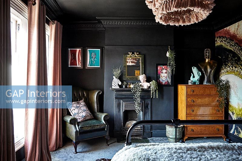 Eclectic black painted bedroom 