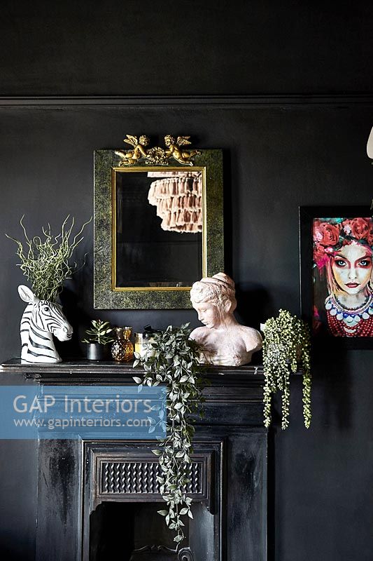 Black painted walls and fireplace 