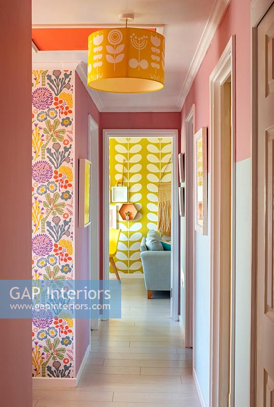Colourful hallway with retro style patterned wallpaper 