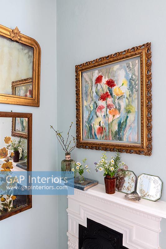 Floral painting over fireplace 