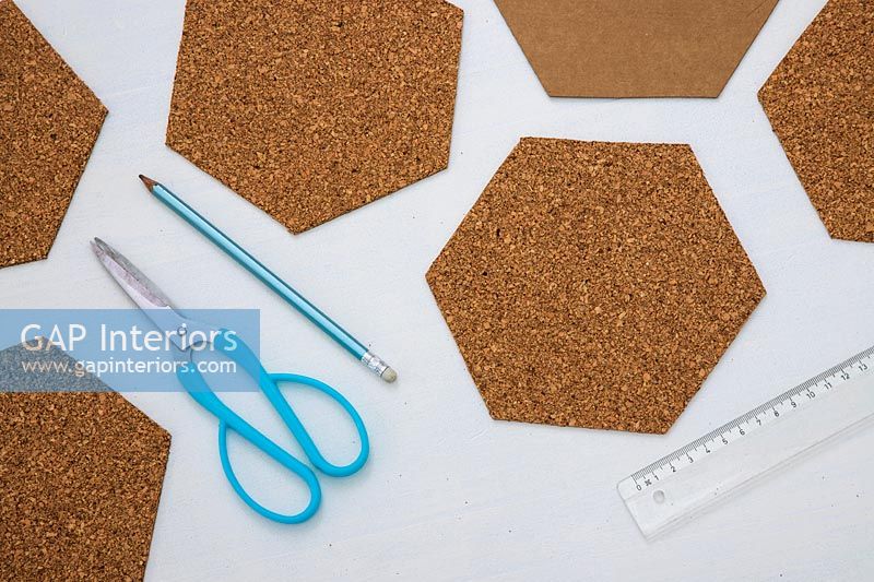 Cut out hexoganal shapes from sheet of cork