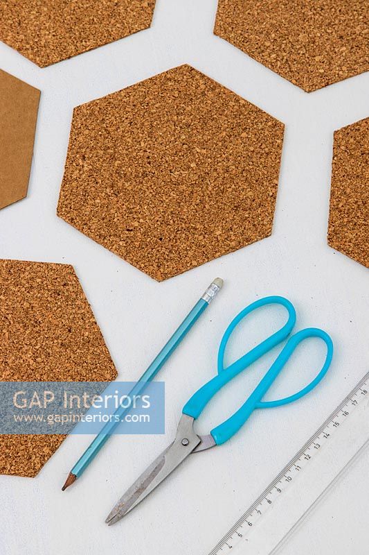 Cut out hexoganal shapes from sheet of cork