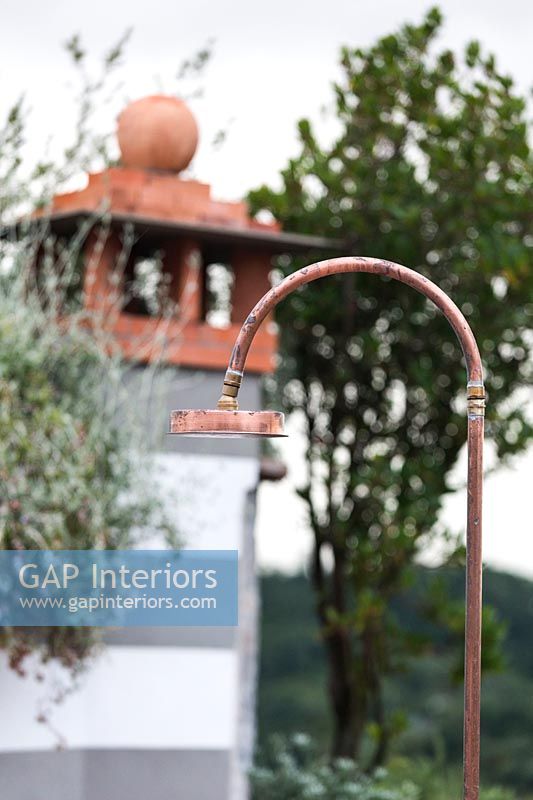 Outdoor copper shower on balcony