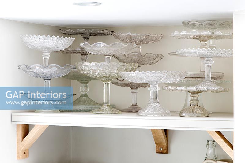 A collection of glass cake stands
