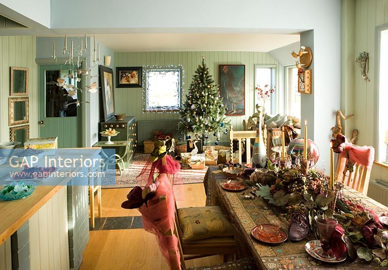 Dining room and living room decorated for Christmas