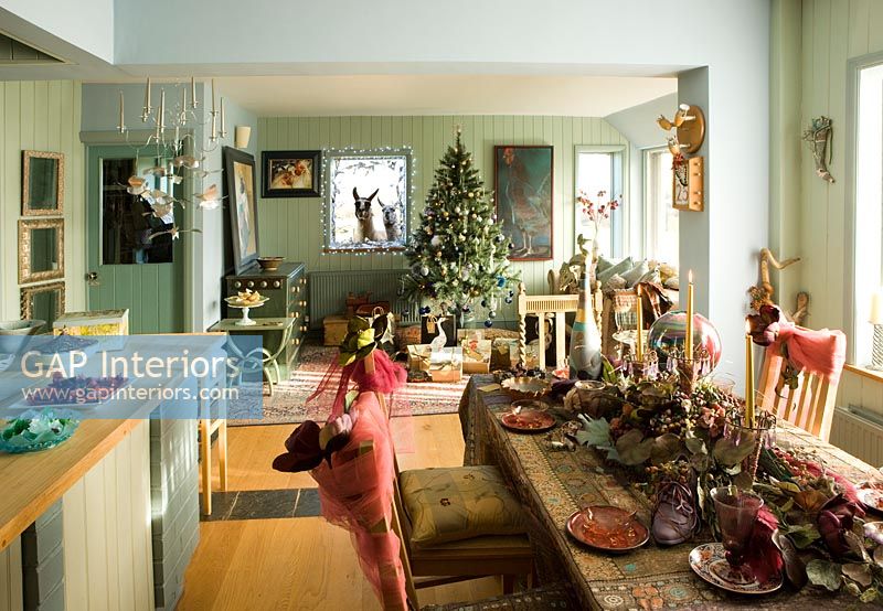 Dining room and living room decorated for Christmas