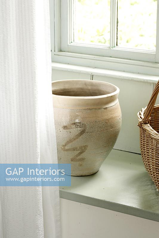 Ceramic pot in window 