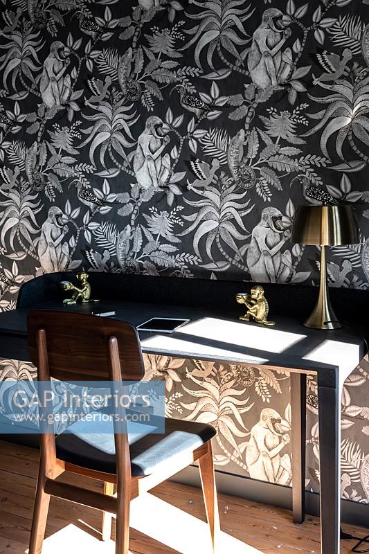 Black and silver wallpaper in study 
