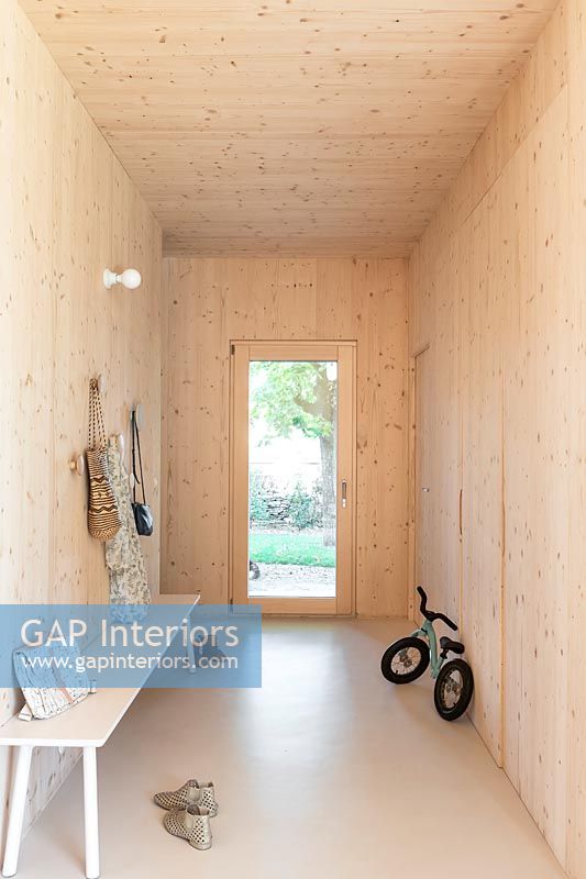 Timber clad modern entrance hallway