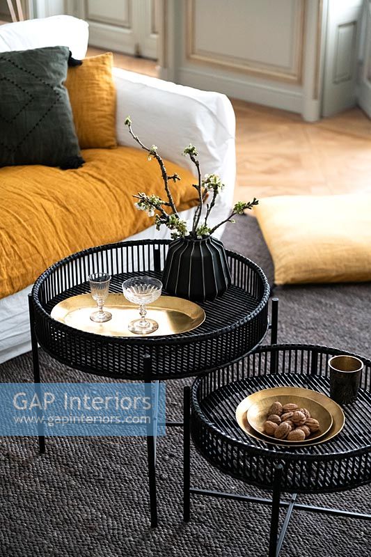 Black side tables with gold accessories 