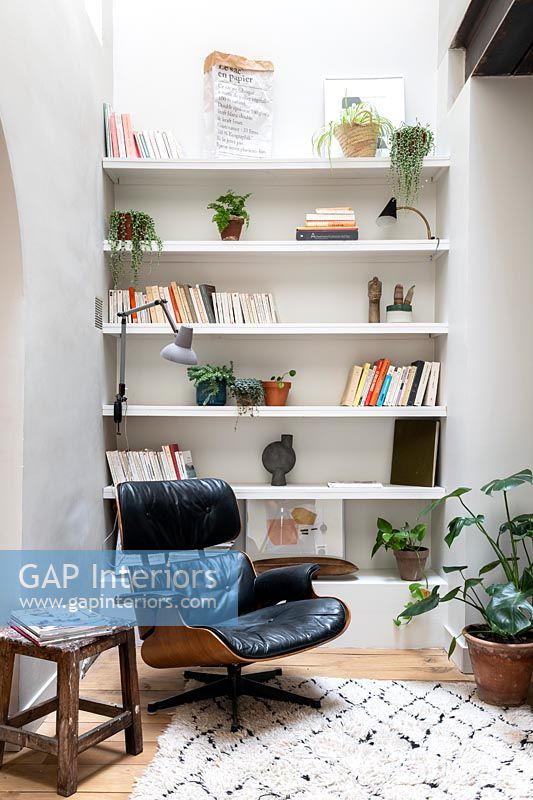 Built-in shelves and designer chair