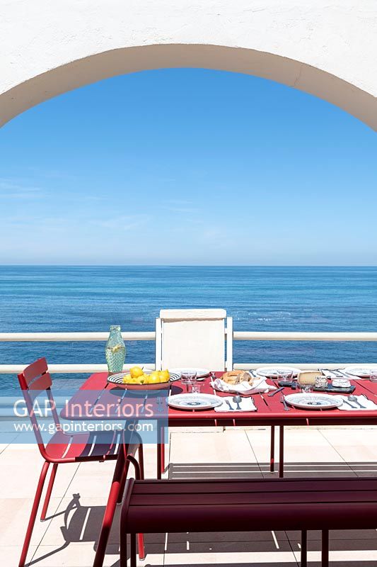 Outdoor dining area with sea views 
