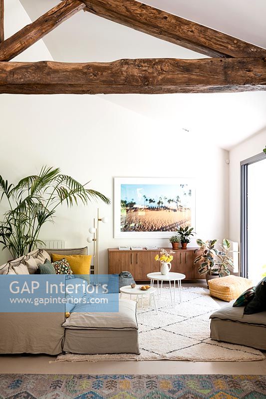 Exposed wooden beams in modern living room 